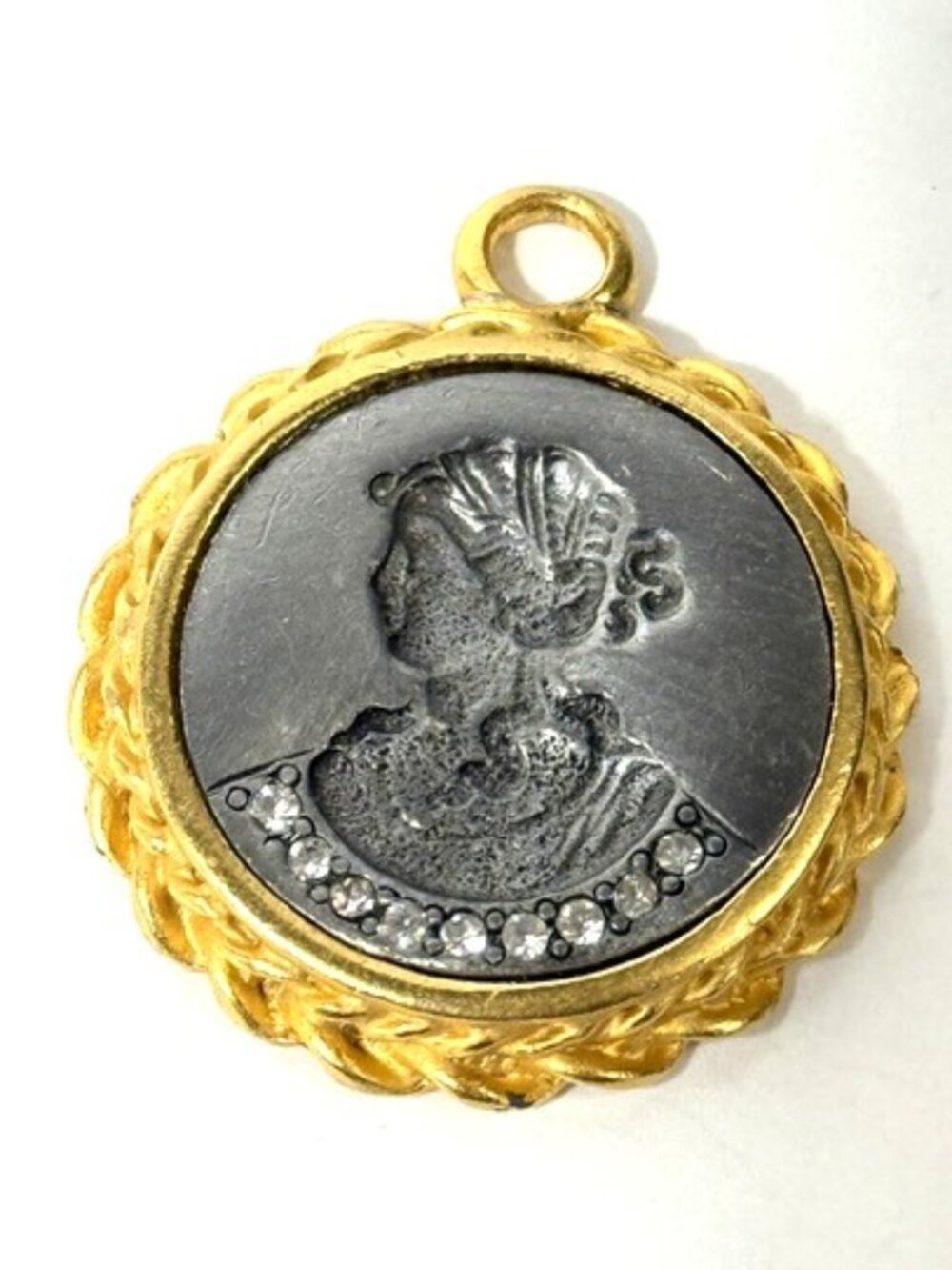 Vintage reverse carved intaglio gray and gold-tone cameo lady pendant.